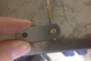 Aligning the spring pin to backing spring steel
